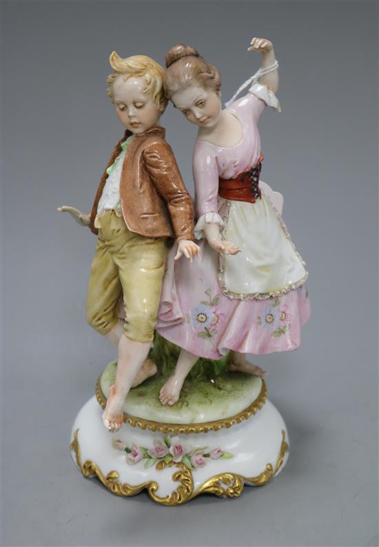 A Capo di Monte figure group of a boy and girl dancing height 20cm